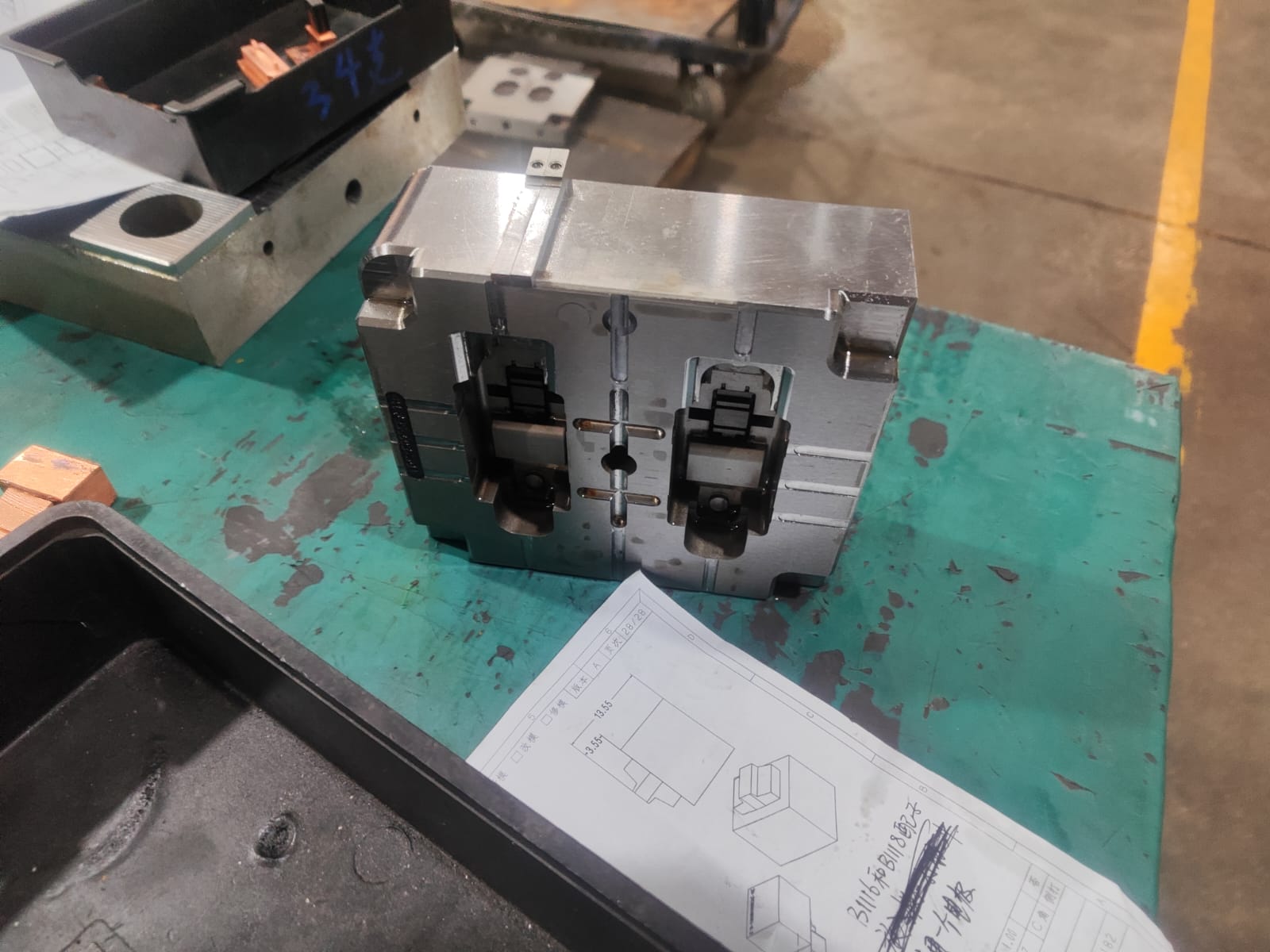 Two-cavity plastic mold with molded parts